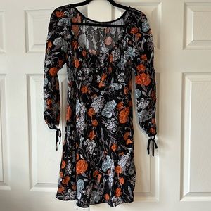 Long sleeve floral dress with tie detail